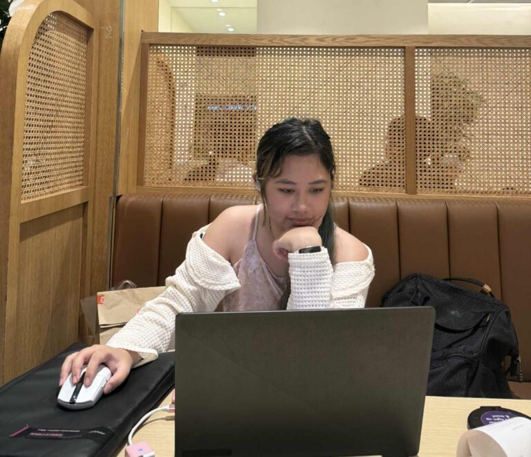 The Geekly Gal on laptop